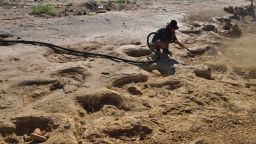 The Museum uncovering the sauropod trackway with air blaster - dinosaur footprints discovered in Queensland