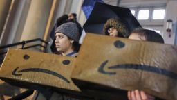 NEW YORK, Nov. 27, 2018 -- People attend an anti-Amazon rally in Long Island City of New York, the United States, Nov. 26, 2018. Hundreds of New Yorkers braved heavy rains and gathered in a Long Island City neighborhood on Monday evening to protest e-commerce giant Amazon's recent announcement of locating a second headquarters here. (Xinhua/Wang Ying) (Xinhua/Wang Ying via Getty Images)