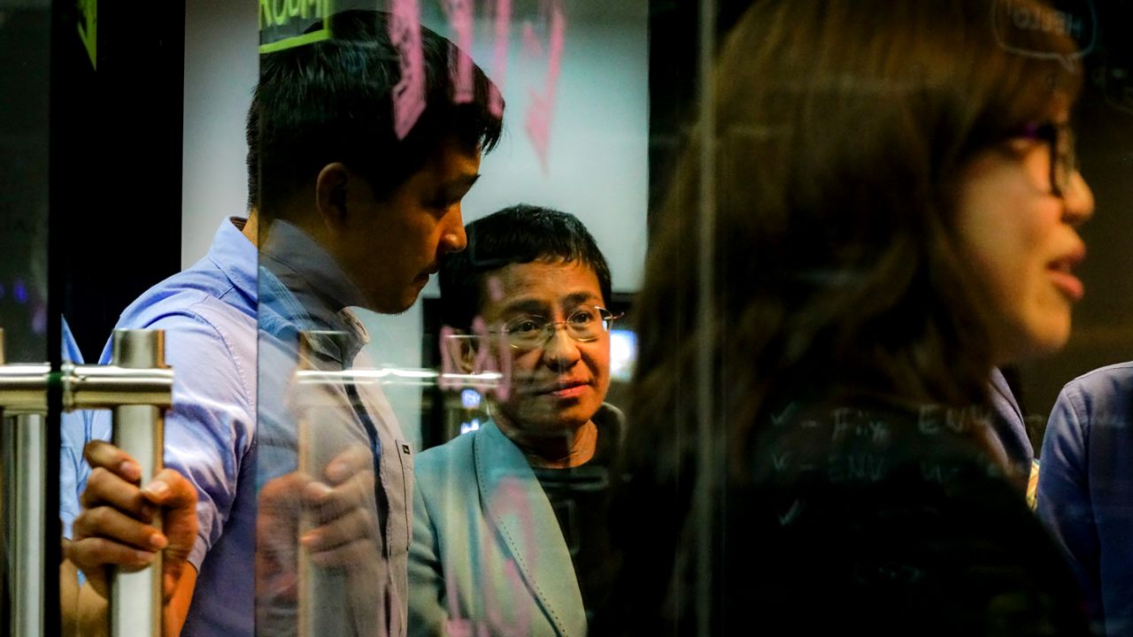 Journalist Maria Ressa leaves her Manila office after she was arrested on February 13, 2019.
