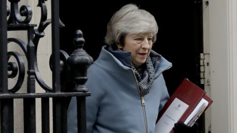 British Prime Minister Theresa May leaves 10 Downing Street in London to attend Prime Minister's Questions at the Houses of Parliament on Wednesday. 