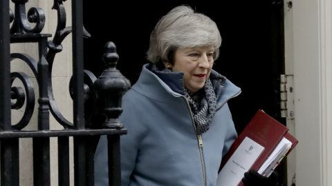 British Prime Minister Theresa May leaves 10 Downing Street in London to attend Prime Minister's Questions at the Houses of Parliament on Wednesday.
