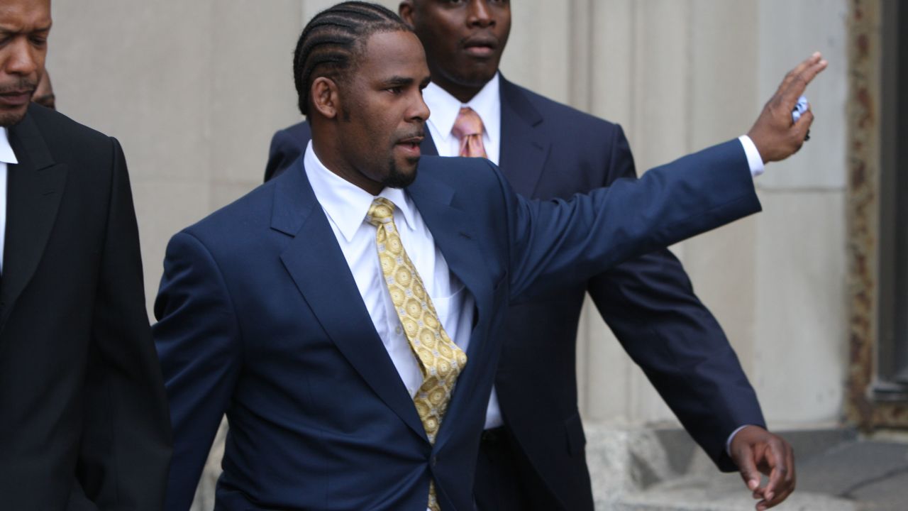 R. Kelly waves to supporters after he was acquitted of child pornography charges.