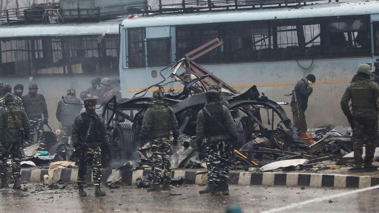 Indian security forces inspect the remains of a bus following an attack on a paramilitary convoy on February 14 in Indian-controlled Kashmir.