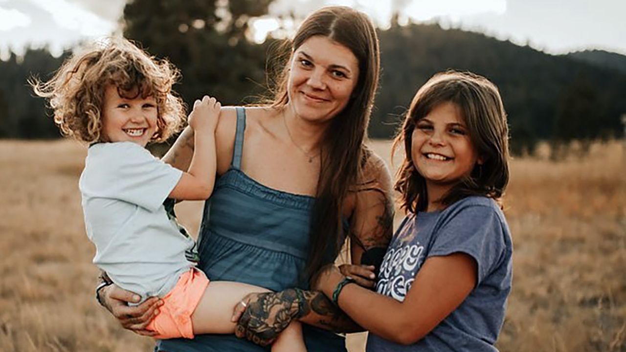 Author Stephanie Land (center) is shown here with her daughters Coraline (left) and Mia (right).