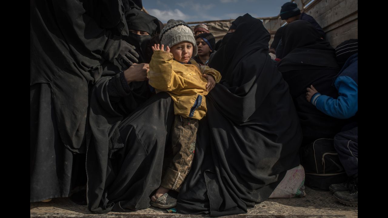 Civilians fleeing the eastern Syrian town of Baghouz Al-Fawqani board trucks after being screened by members of the US-backed Syrian Democratic Forces on Saturday, February 9. The SDF <a href="https://www.cnn.com/2019/02/09/middleeast/syria-isis-last-territorial-battle/index.html" target="_blank">launched an offensive this past weekend</a> to oust ISIS from Baghouz Al-Fawqani, its last remaining enclave in Syria. <a href="https://www.cnn.com/interactive/2019/02/world/syria-isis-cnnphotos/index.html" target="_blank">Photos: On the front lines in the fight against ISIS</a>