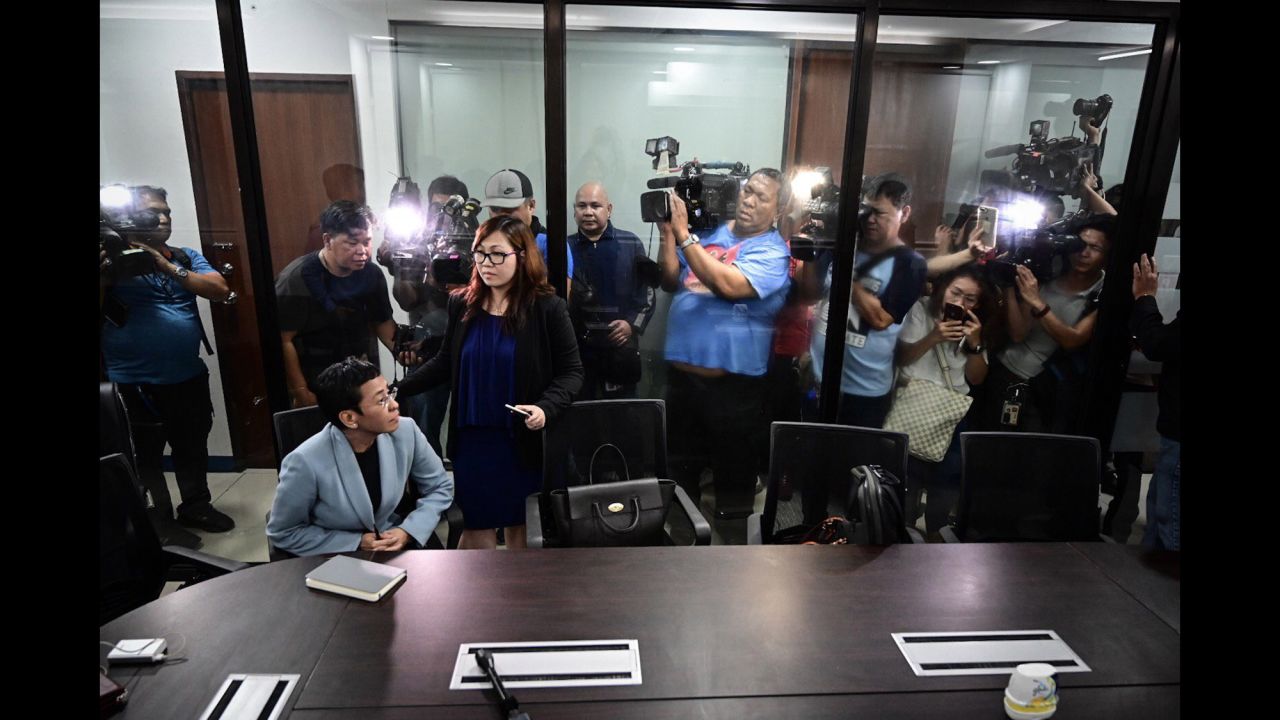 Members of the media film journalist Maria Ressa as she sits inside the National Bureau of Investigation's office in Manila, Philippines, on Wednesday, February 13. Ressa, the co-founder and editor of online news outlet Rappler, told CNN that <a href="https://www.cnn.com/2019/02/14/asia/maria-ressa-rappler-posts-bail-intl/index.html" target="_blank">her recent arrest on "cyber libel" charges</a> is an example of how the law is being "weaponized" against critics of Philippines President Rodrigo Duterte. 