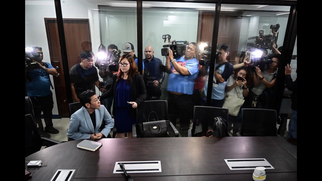 Members of the media film journalist Maria Ressa as she sits inside the National Bureau of Investigation's office in Manila, Philippines, on Wednesday, February 13. Ressa, the co-founder and editor of online news outlet Rappler, told CNN that <a href="https://www.cnn.com/2019/02/14/asia/maria-ressa-rappler-posts-bail-intl/index.html" target="_blank">her recent arrest on "cyber libel" charges</a> is an example of how the law is being "weaponized" against critics of Philippines President Rodrigo Duterte.
