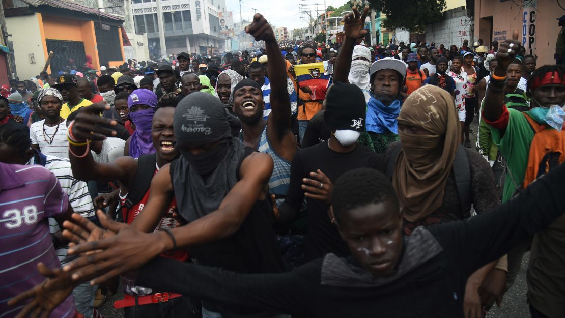 Demonstrators march in Port-au-Prince on February 12.