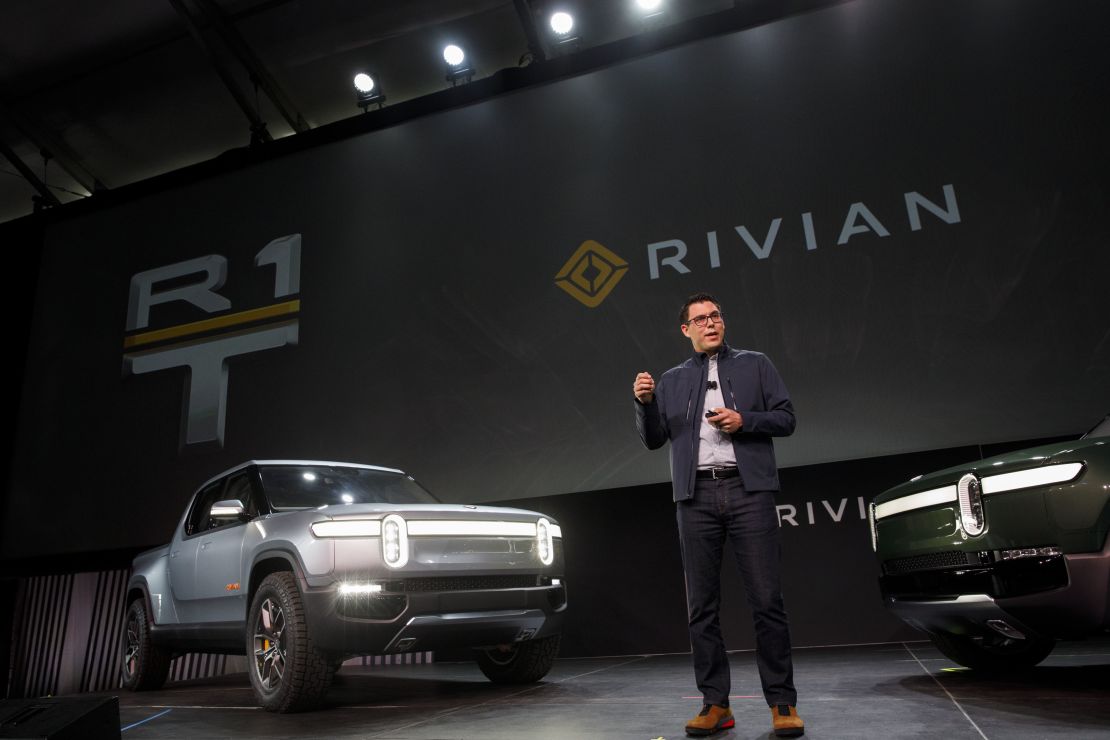 RJ Scaringe, founder and chief executive officer of Rivian Automotive Inc., unveils the R1T electric pickup truck and R1S electric SUV in Los Angeles.