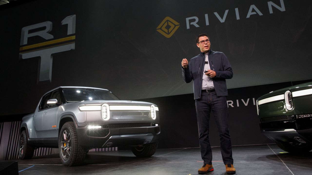 RJ Scaringe, founder and chief executive officer of Rivian Automotive Inc., unveils the R1T electric pickup truck and R1S electric SUV in Los Angeles.
