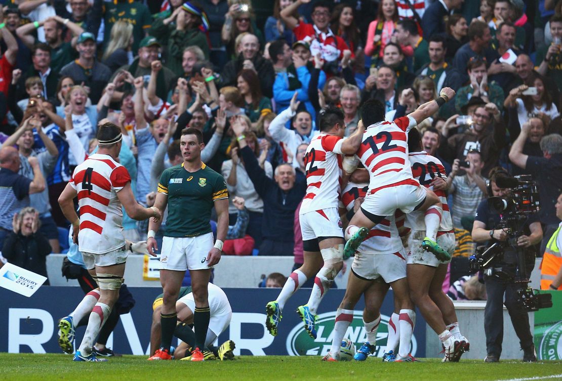 Japanese players celerbate defeating South Africa in 2015. 