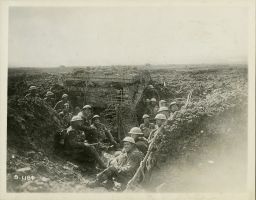 Canadian soldiers sit in a captured German machine gun emplacement during the Battle of Vimy Ridge in April 1917.