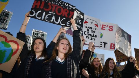 School students attend a climate change protest in central London on February 15, 2019. 