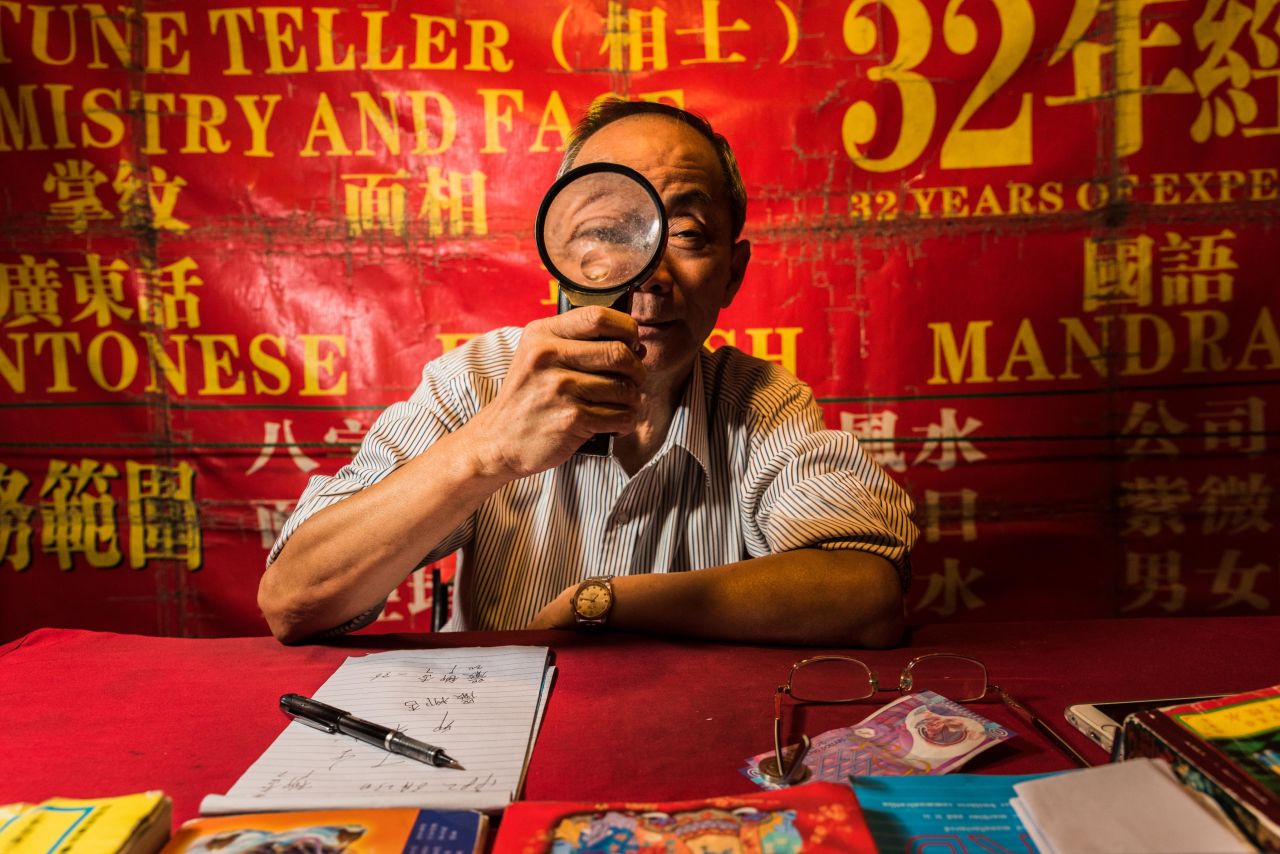 Fortune teller William Kan operates a stall on Temple Street, home to Hong Kong's soothsayers since the 1970s.