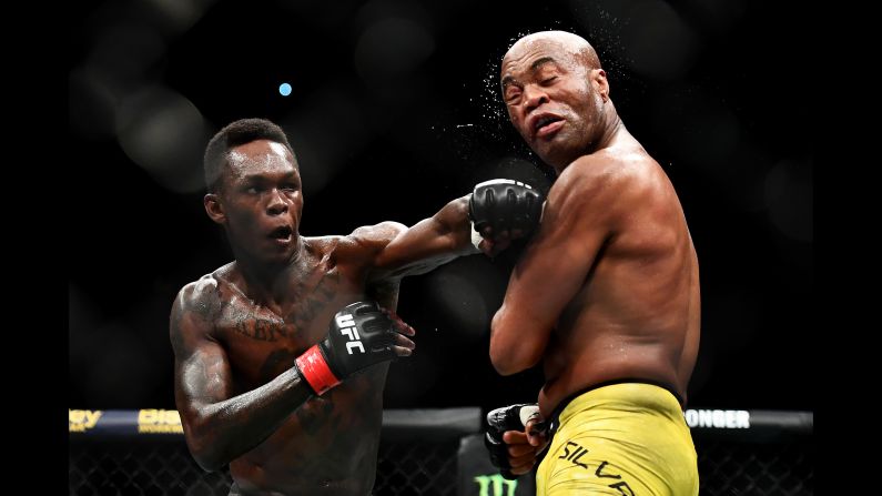 Israel Adesanya of Nigeria punches Anderson Silva of Brazil during their middleweight bout on Sunday, February 10.