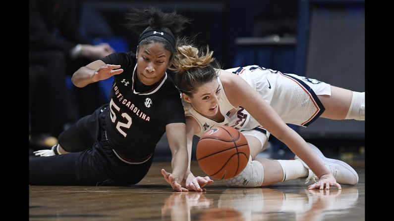 South Carolina's Tyasha Harris, left, and Connecticut's Katie Lou Samuelson dive for a loose ball during the second half of an NCAA college basketball game on Monday, February 11.