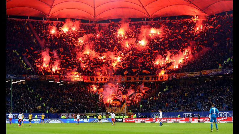 Fans of Dresden burn flares during the Second Bundesliga match between Hamburger SV and SG Dynamo Dresden on February 11 in Hamburg, Germany.