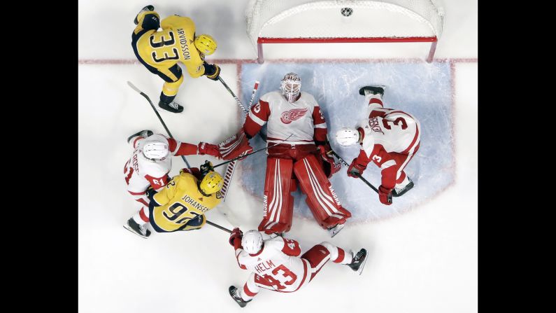 Detroit Red Wings goaltender Jimmy Howard covers up the puck during the third period against the Nashville Predators on Tuesday, February 12.