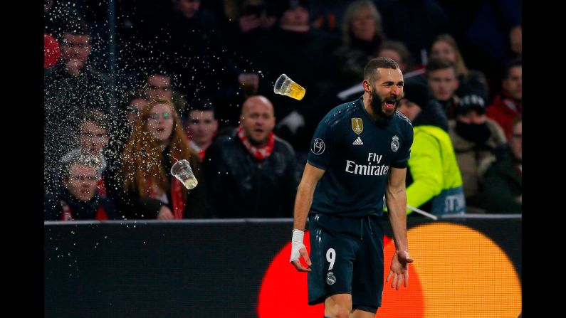 Karim Benzema celebrates after scoring during the first leg, round of sixteen, Champions League soccer match between Ajax and Real Madrid at the Johan Cruyff Arena in Amsterdam, Netherlands, on Wednesday, February 13.