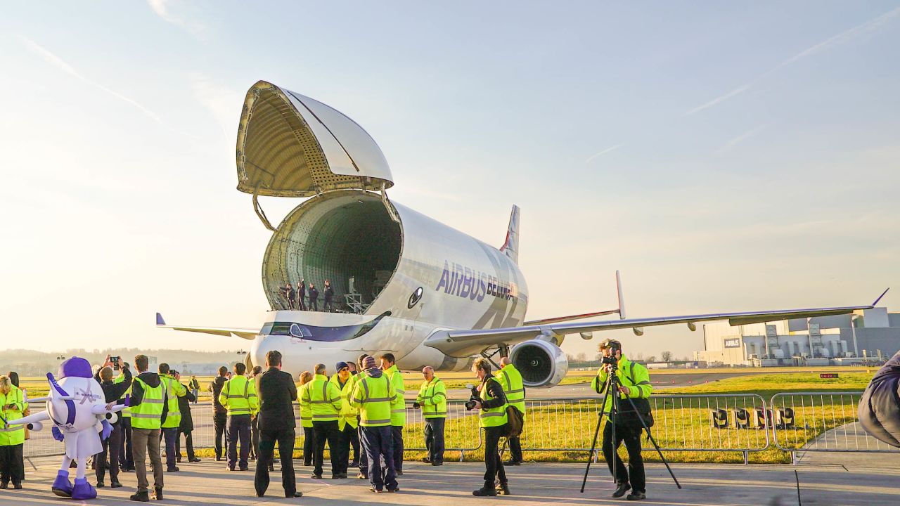 <strong>Cargo bay: </strong>The crew are greeted by Airbus staff as they stand in the cargo bay of the Beluga XL. 