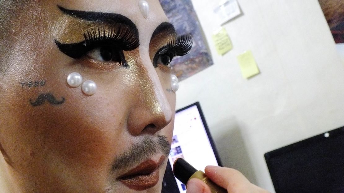 Hurricane Kimchi putting on makeup before a drag show at Alley Bunker in the Itaewon district of Seoul. 