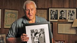 George Mendonsa, 89, holds one of the most iconic photographs of the 20th century at his Middletown, Rhode Island home, October 2,3 2012. In the photograph, Mendonsa is widely believed to be the sailor kissing an unsuspecting nurse (actually a dental hygienist) on V-E Day in Times Square in 1945. The photograph was taken by Life Magazine photographer Alfred Eisenstaedt. (Patrick Raycraft/Hartford Courant/MCT via Getty Images)