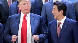 BUENOS AIRES, ARGENTINA - NOVEMBER 30: (L-R) President of  U.S. President Donald Trump and Prime Minister of Japan Shinzo Abe talk during the family photo opening day of Argentina G20 Leaders' Summit 2018 at Costa Salguero on November 30, 2018 in Buenos Aires, Argentina. (Photo by Daniel Jayo/Getty Images)