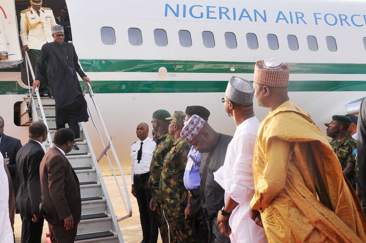 Buhari disembarks from a plane <a href="http://edition.cnn.com/2017/03/10/africa/nigeria-president-buhari-return-medical-leave-uk/" target="_blank">upon his return to Nigeria</a> in March 2017. He had spent nearly two months in London receiving medical treatment for an undisclosed illness.