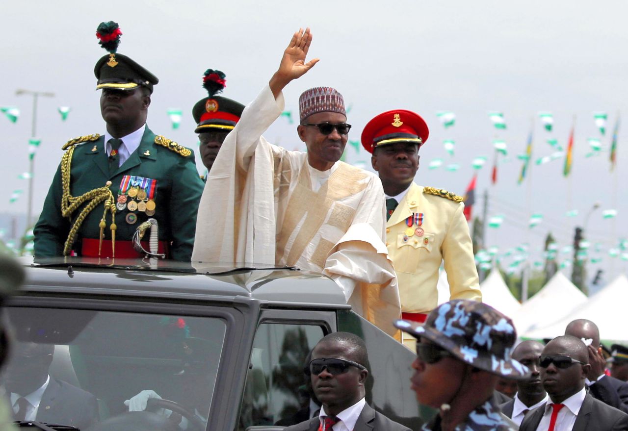 Buhari greets a crowd as he is sworn in to office in May 2015.