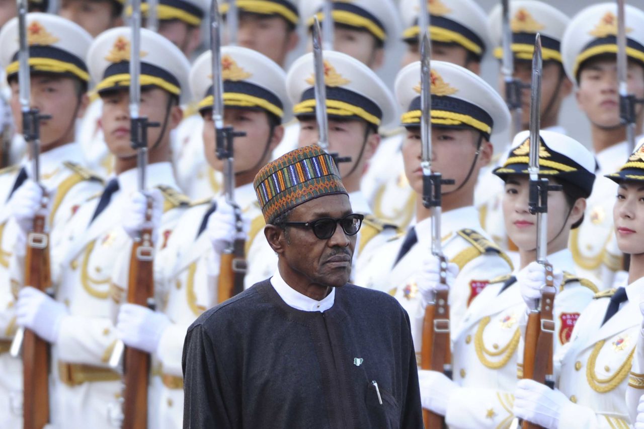Buhari inspects a Chinese honor guard during a visit to Beijing in April 2016. 