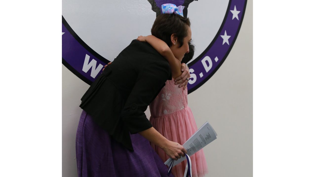 Prisilla gave her teacher a hug in appreciation.