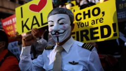 SEOUL, SOUTH KOREA - MAY 04:  Korean Air pilots, cabin crew and activists, many wearing Guy Fawkes masks, attend a rally on May 4, 2018 in Seoul, South Korea. Employees of South Korea's national carrier Korean Air gathered to call for resignation of Hanjin Group Chairman Cho Yang-ho, who has been under criticism after his daughter and wife's alleged abuse of power prompted police questioning and a customs probe.  (Photo by Chung Sung-Jun/Getty Images)