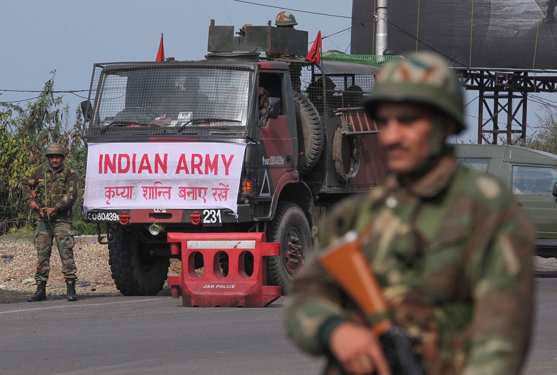 An Indian army soldier stands guard during a curfew in Jammu on February 18, 2019. 