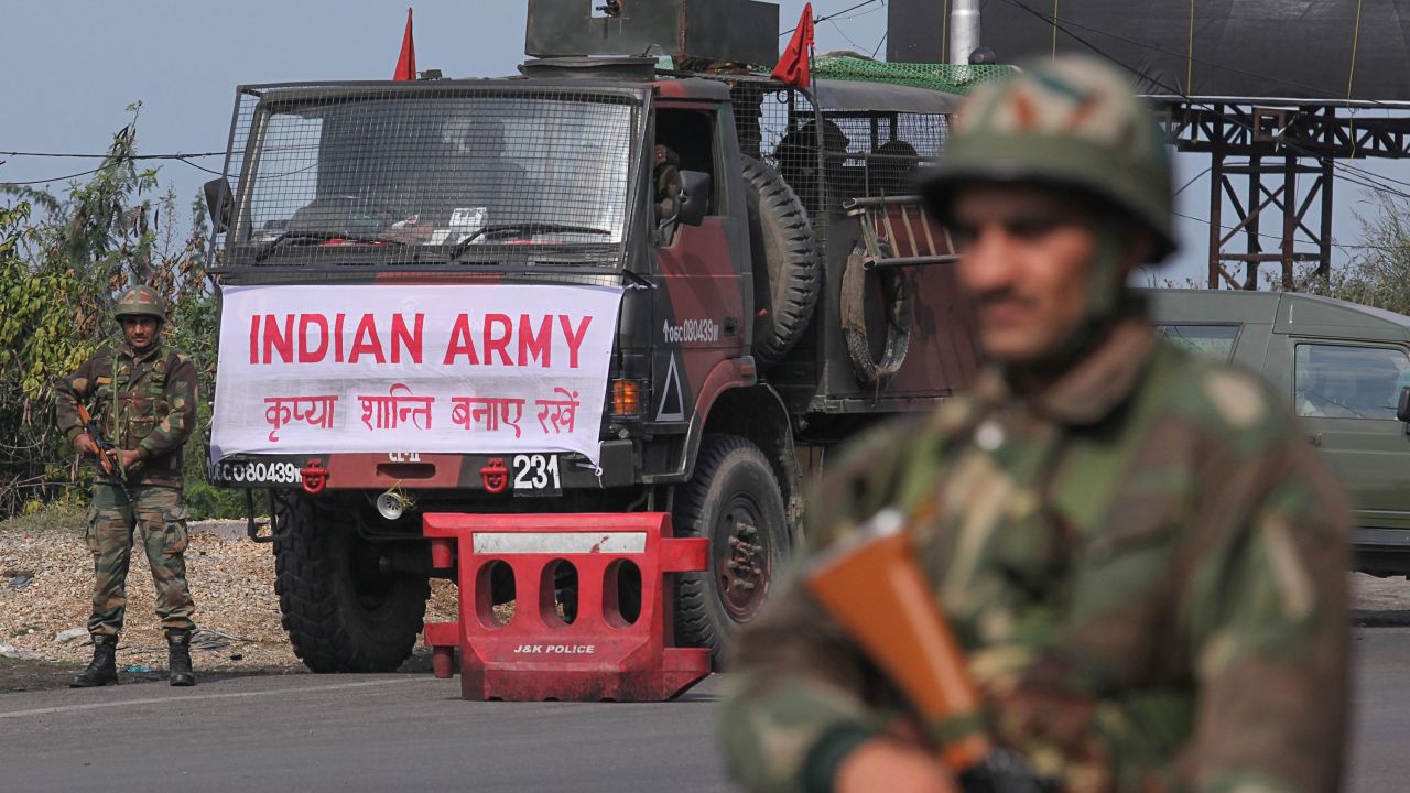 An Indian army soldier stands guard during a curfew in Jammu.