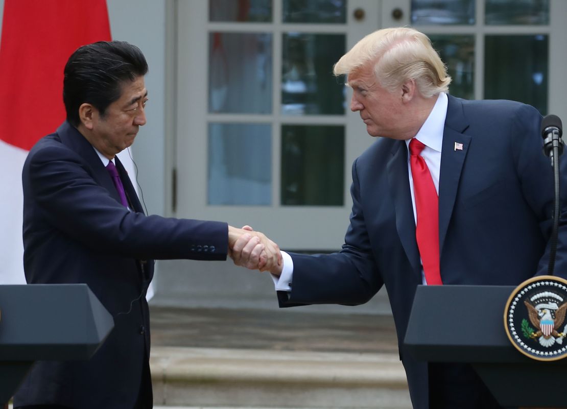 President Donald Trump (R) and Japanese Prime Minister Shinzo Abe shake hands as they speak to the media during a news conference in the Rose Garden at the White House, on June 7, 2018 in Washington, DC. 