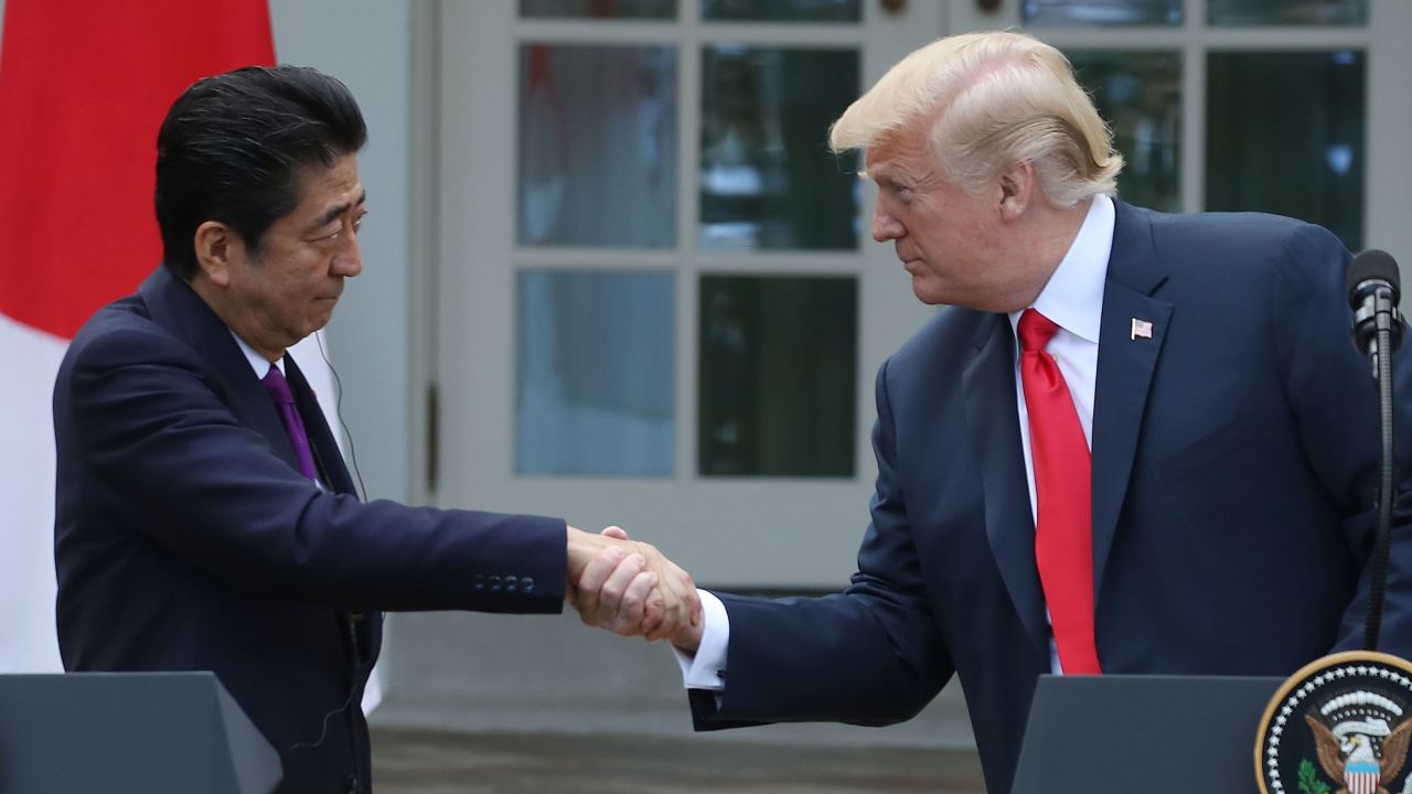 President Donald Trump (R) and Japanese Prime Minister Shinzo Abe shake hands as they speak to the media during a news conference in the Rose Garden at the White House, on June 7, 2018 in Washington, DC.