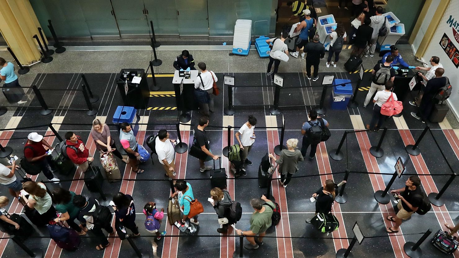 Travelers move through one of the TSA lines at Ronald Reagan National Airport.