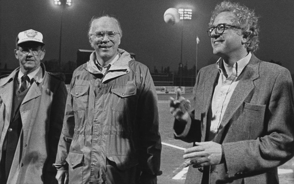 Sanders, right, tosses a baseball before a minor-league game in Vermont in 1984. US Sen. Patrick Leahy, center, was also on hand.