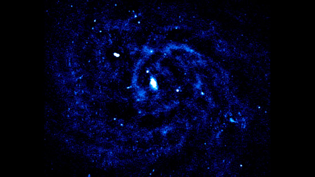 Nearby spiral galaxy IC342 gives off radio emissions in its spiral arms, which is due to supernova explosions. 