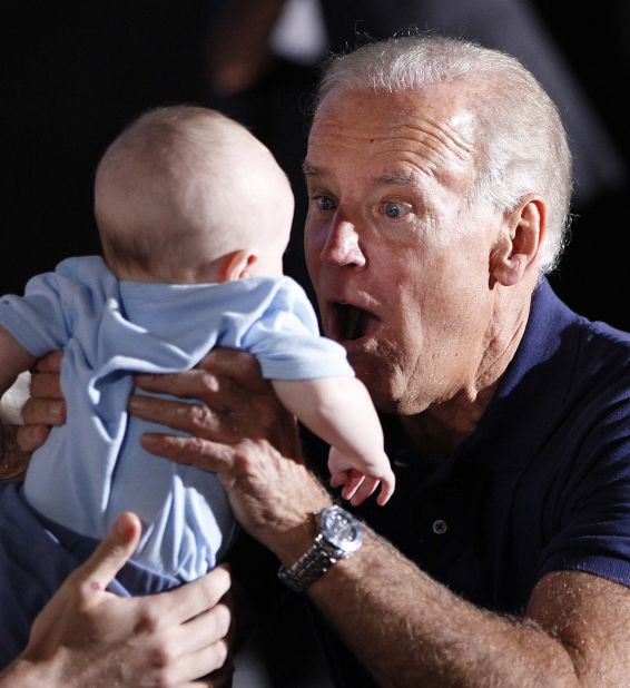 Biden holds a baby during a campaign event in Eau Claire, Wisconsin, in September 2012.