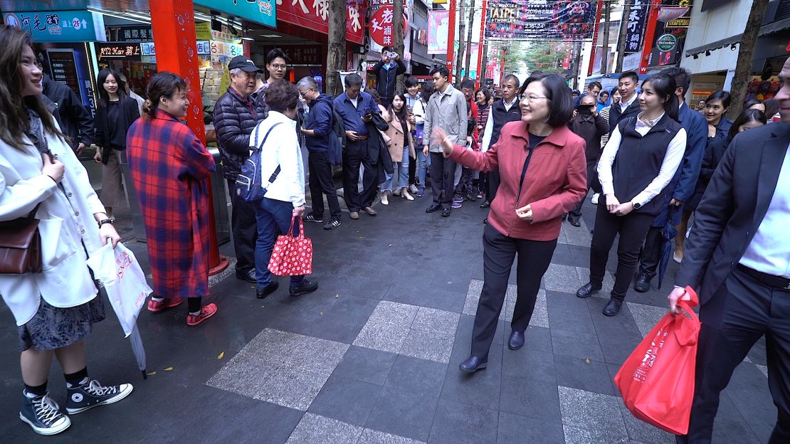 Tsai meets with her constituents on a street in the capital Taipei on February 18.