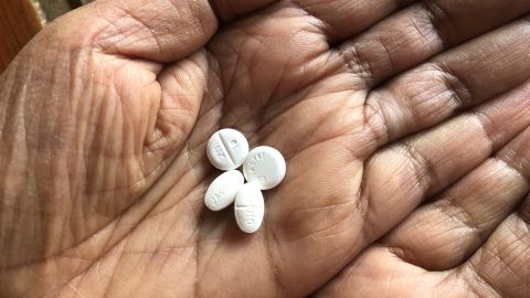 Patel shows off the once-free oval pill made by Jacobus, compared to Firdapse, made by Catalyst.