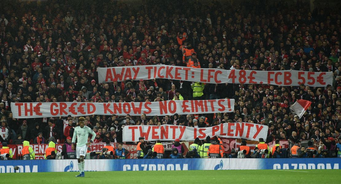 Bayern fans display placards complaining about ticket prices during the Champions League round of 16, first leg between Liverpool and Bayern Munich at Anfield on February 19, 2019. 