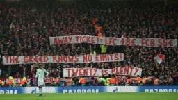 Bayern fans display placards complaining about ticket prices during the UEFA Champions League round of 16, first leg football match between Liverpool and Bayern Munich at Anfield stadium in Liverpool, north-west England on February 19, 2019. (Photo by Oli SCARFF / AFP)        (Photo credit should read OLI SCARFF/AFP/Getty Images)