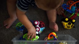 A baby plays with toys at the Monahans Bright Stars LLC daycare center in Monahans, Texas in 2018. 