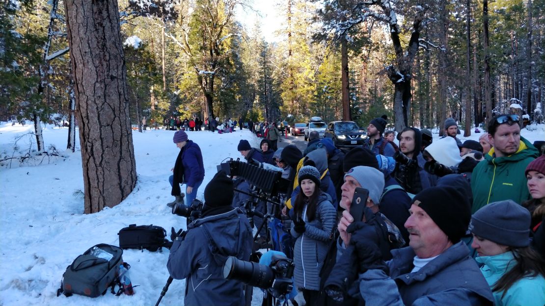 A crowd gathers ahead of sun set to capture the 'Firefall.'