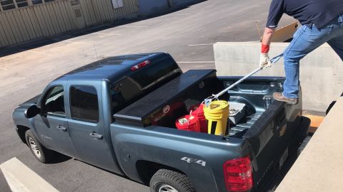 Workers reportedly wore gardening gloves and used mop handles to lift buckets of uranium.