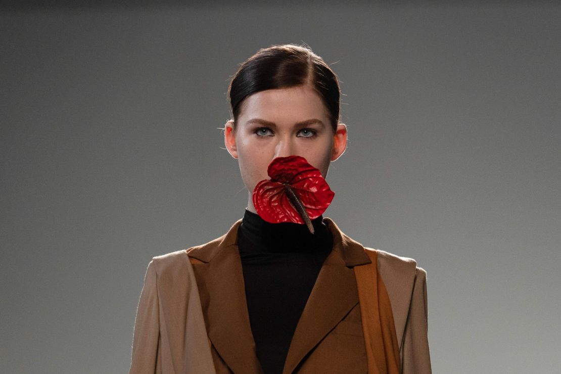 Models at Marta Jakubowski's show carried Anthurium flowers in their mouths.