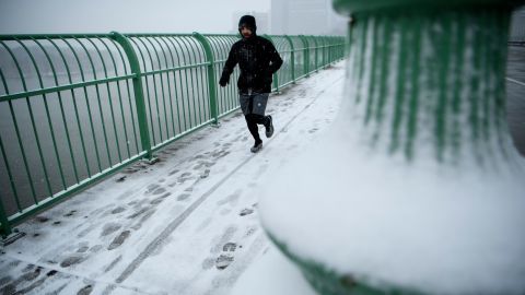 A man runs across the Key Bridge in Washington D.C. on Wednesday.