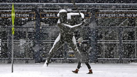 A pedestrian strolls past a statue of Pittsburgh Pirate Willie Stargell outside PNC Park on Wednesday.